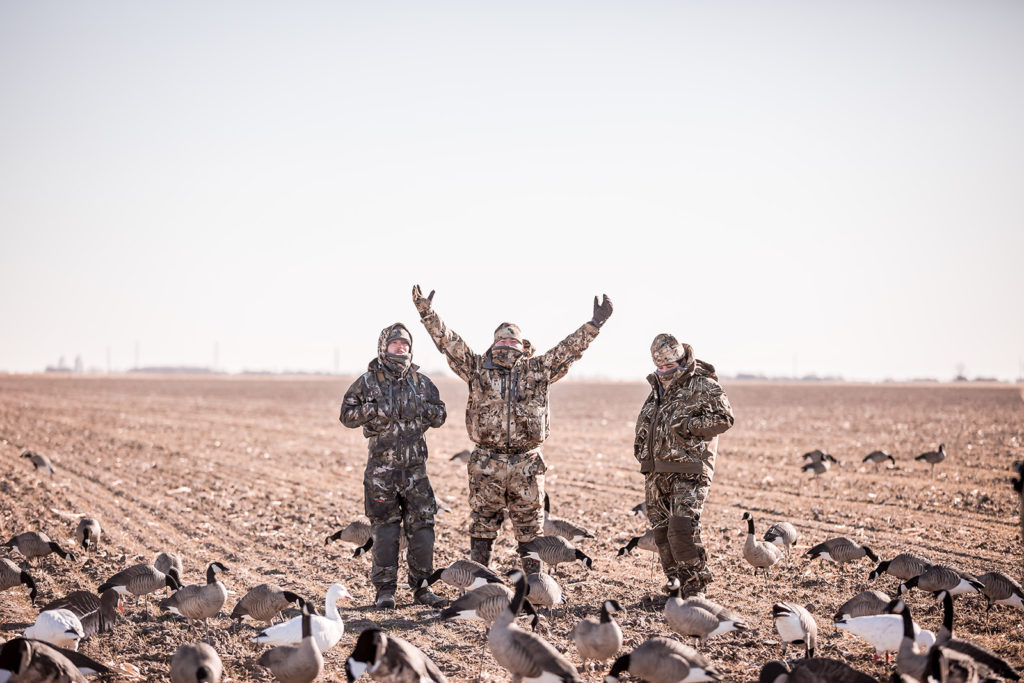 Happy hunters cheering after a successful hunt