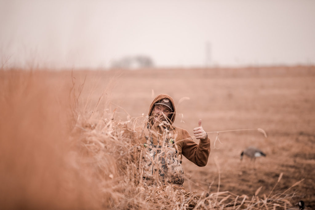 Kansas waterfowl hunter giving hunting guide a thumbs up 